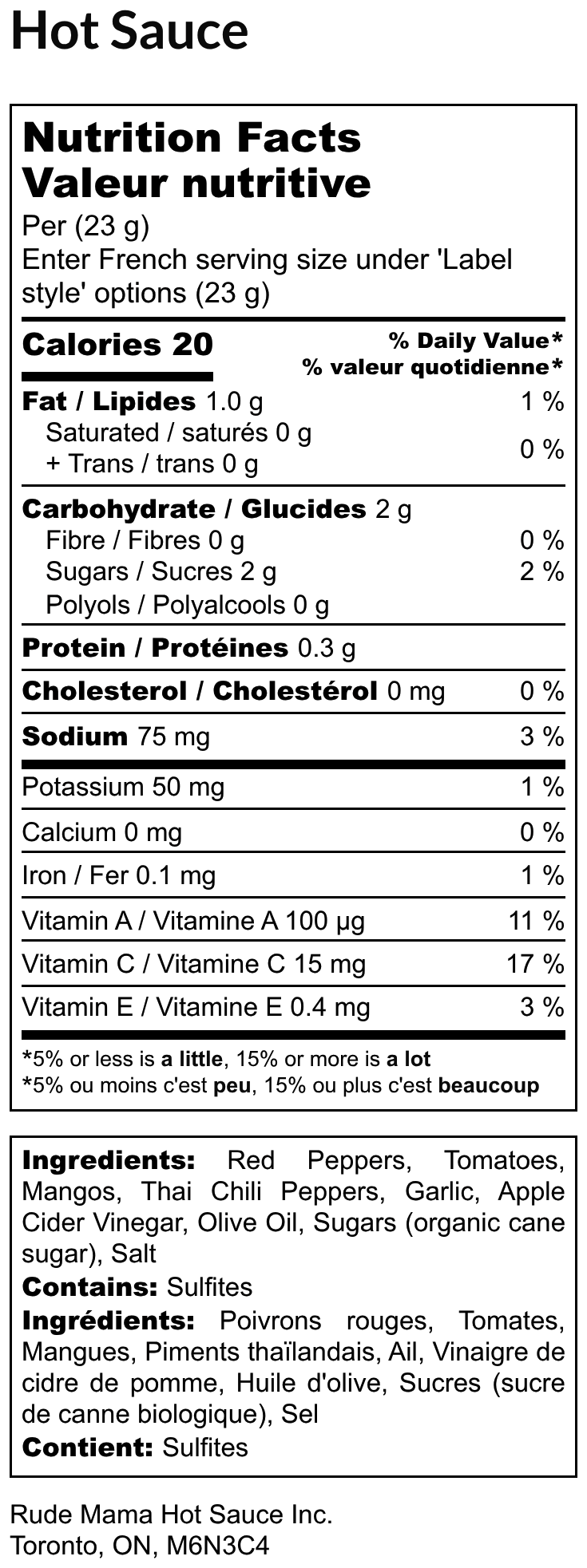 Nutrition facts label for a hot sauce with detailed information on calories, macronutrients, micronutrients, and ingredients.