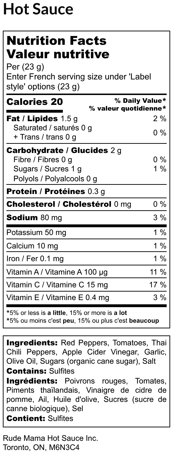 Nutrition facts label for a hot sauce with serving size, calories, and ingredients listed.